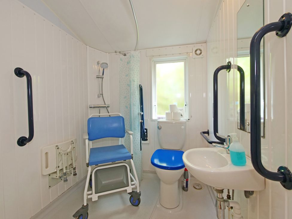 A bathroom with a sink and toilet at Abbey View @ Summerfield Farm, Hawsker