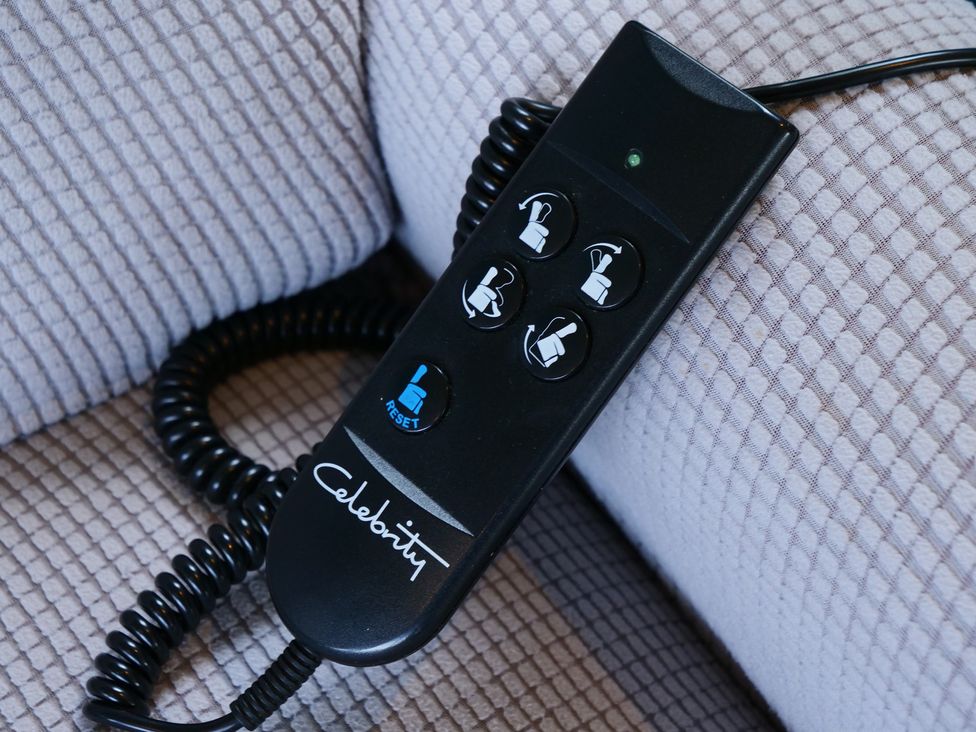 A remote control with buttons for a reclining chair at Abbey View @ Summerfield Farm, Hawsker