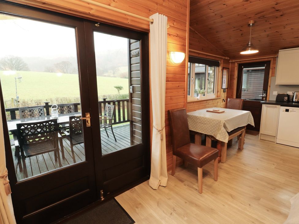 A dining area with a table and chairs at The Fold near Number 28, Burnside Park near Keswick