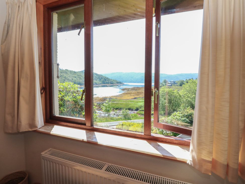 A view of a river and hills from a window at Allt An Dorran in Salen