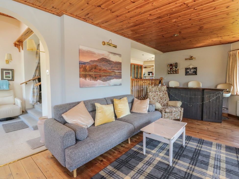 A living room with a sofa and bar at Allt An Dorran in Salen