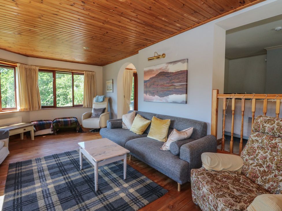 A living room with a sofa and armchair at Allt An Dorran in Salen