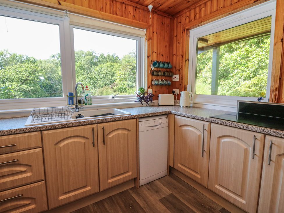 A kitchen with a sink and dishwasher at Allt An Dorran in Salen