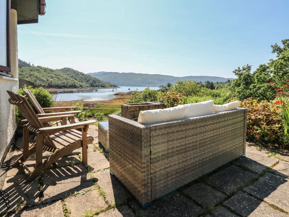 Outdoor seating area with a view of the water at Allt An Dorran in Salen