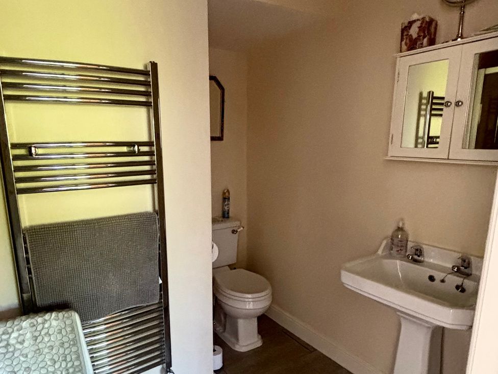 A bathroom with a sink and toilet at The Old Gate House Annexe in Alford