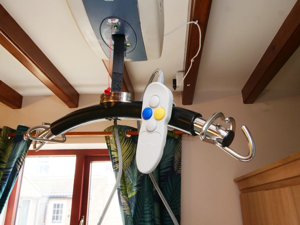 A curtain rod with remote control in a living room at Chomley @ Summerfield Farm in Hawsker