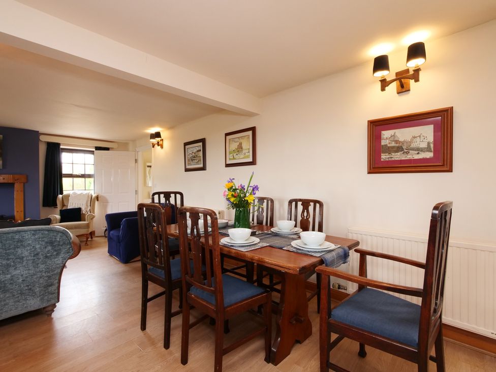 A dining room with a table set for meals at Albany @ Summerfield Farm in Hawsker