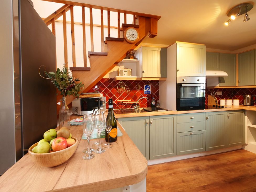 A kitchen with cabinets and a fruit bowl at Albany @ Summerfield Farm in Hawsker