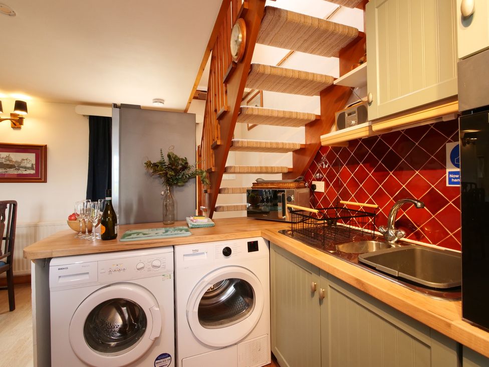 A kitchen with washing machine and dryer at Albany @ Summerfield Farm, Hawsker