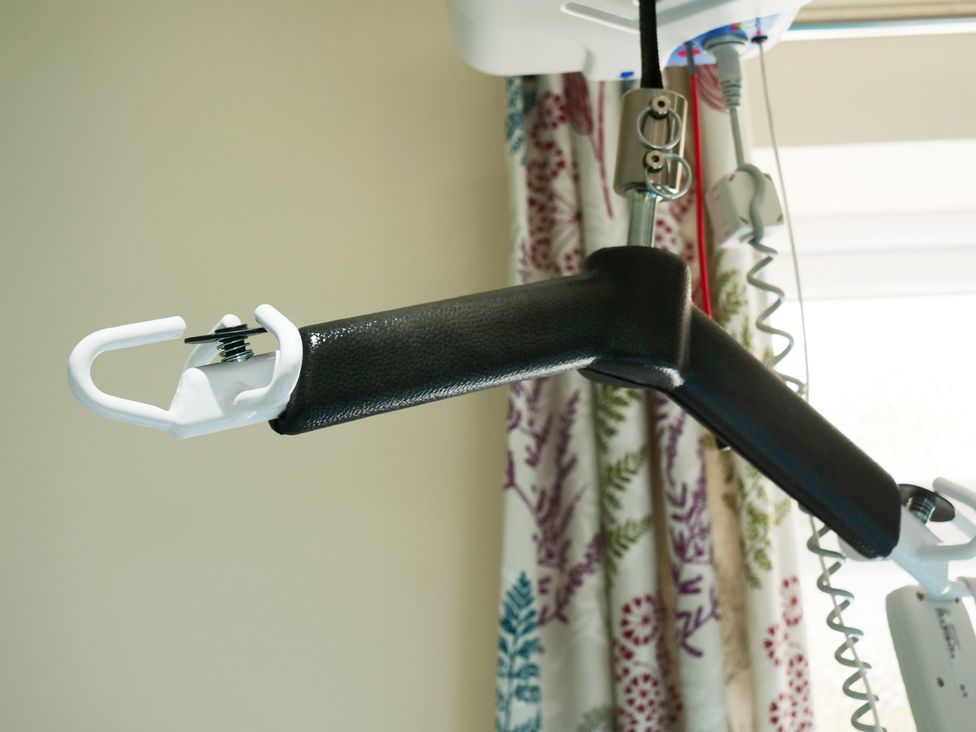 An overhead hoist with a hook in a room at Albany @ Summerfield Farm Hawsker
