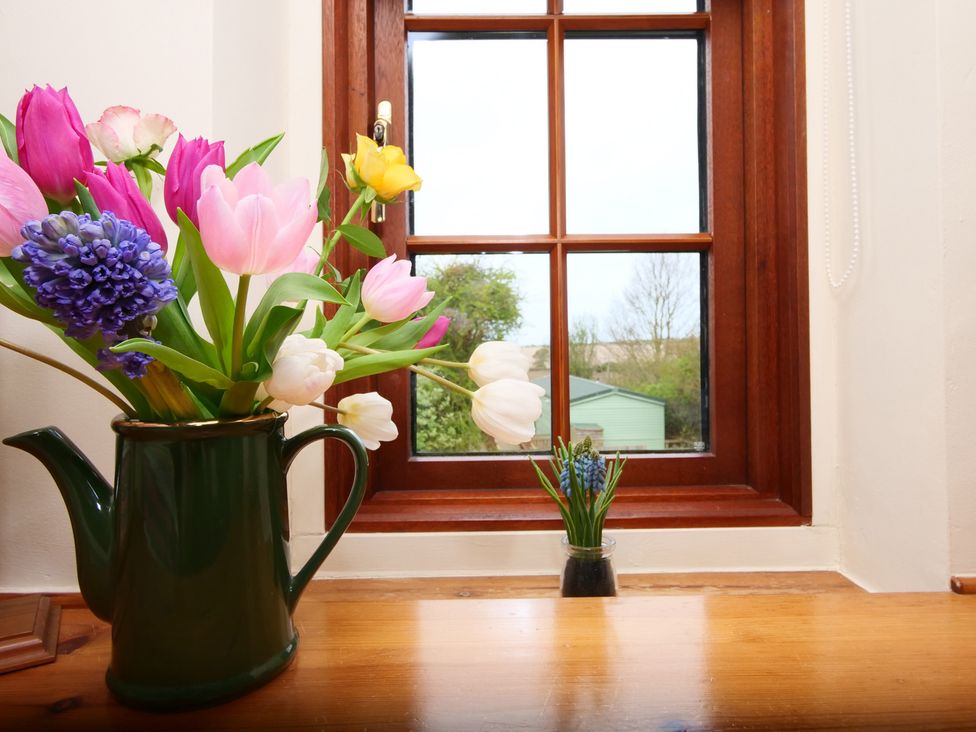 A window with flowers and a vase at Albany @ Summerfield Farm in Hawsker