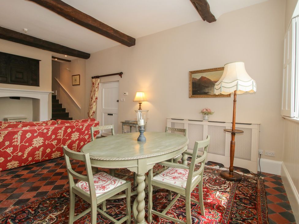 A dining room with a table and chairs at The Butler’s Quarters Bourton near Much Wenlock