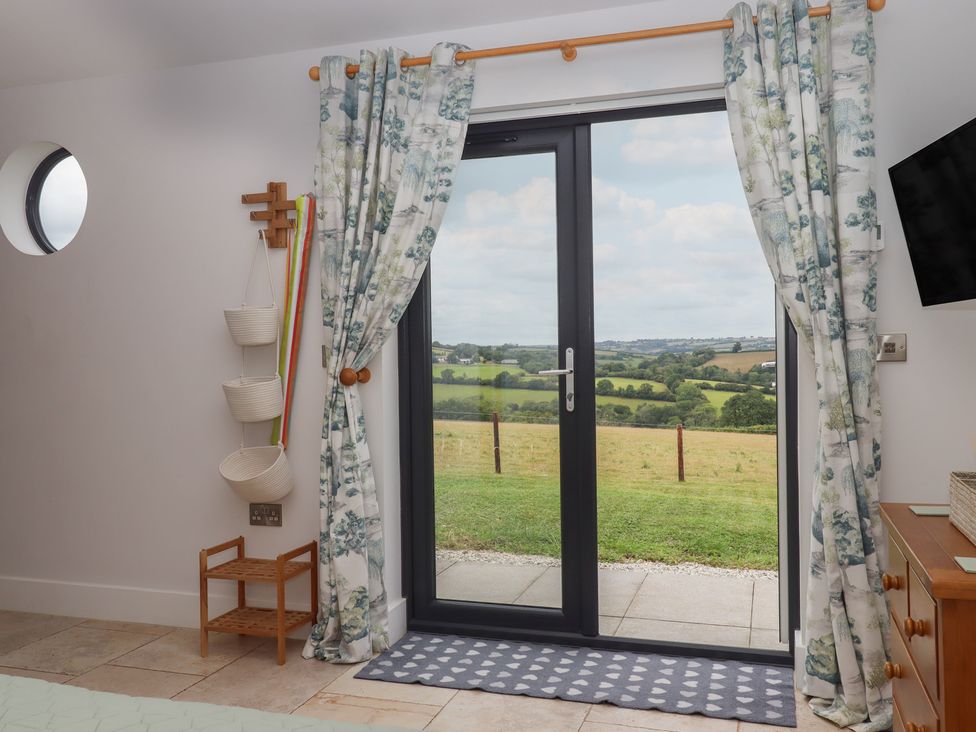 A room with a door leading to a view at The Pennymoor in Cadeleigh near Tiverton