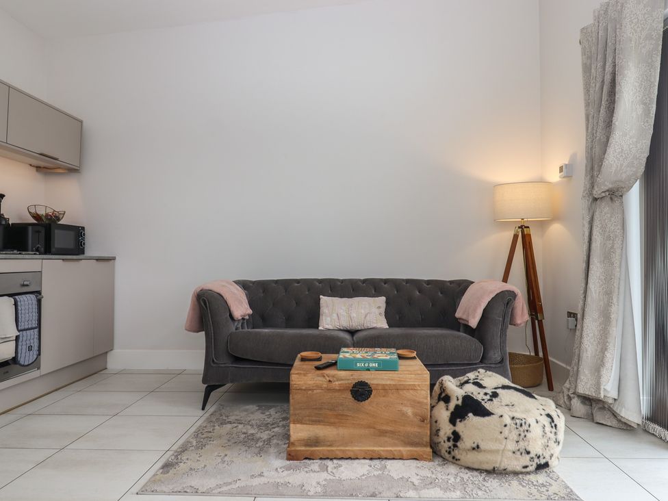 A living room with a couch and coffee table at The Bickleigh Cadeleigh near Tiverton