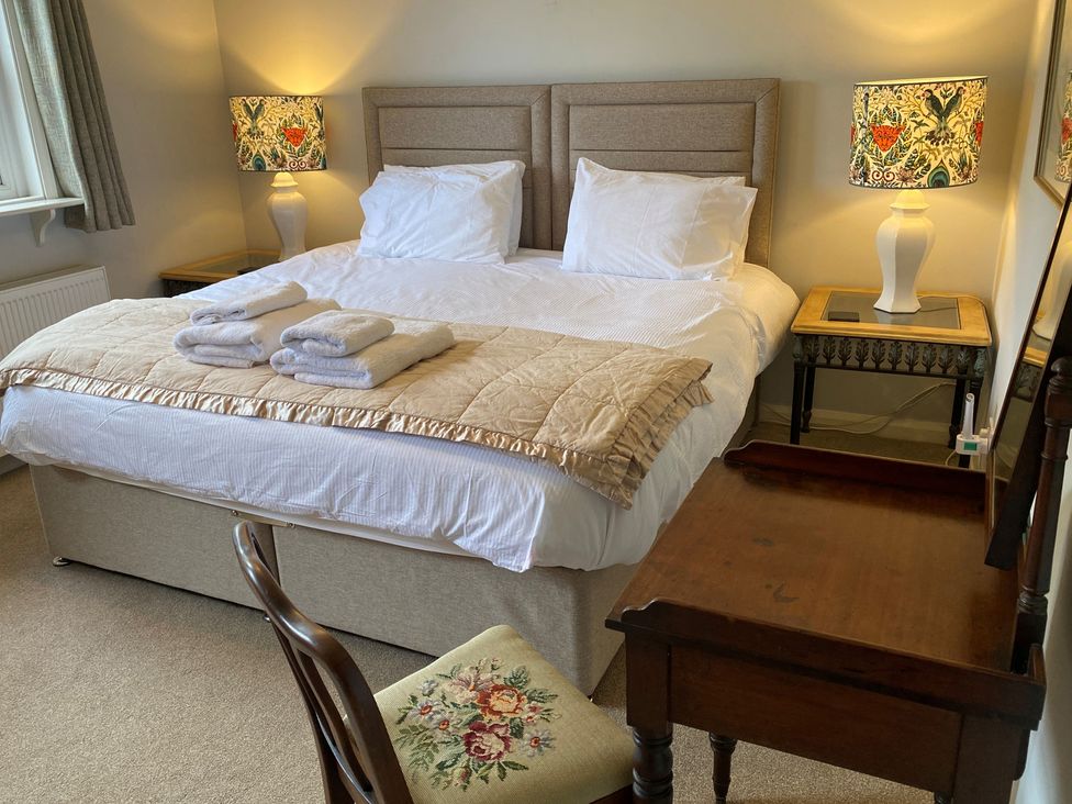 A bedroom with a bed and bedside table at Greywalls in Maulds Meaburn