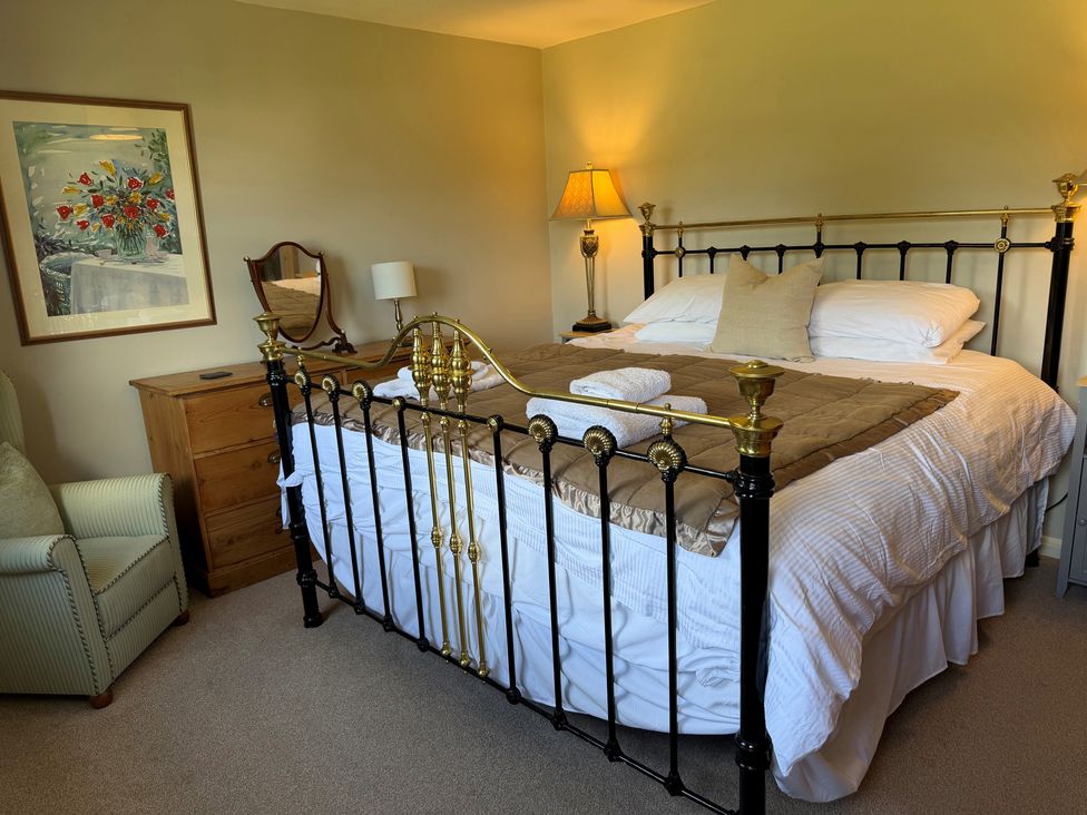 A bedroom with a bed and nightstand at Greywalls in Maulds Meaburn