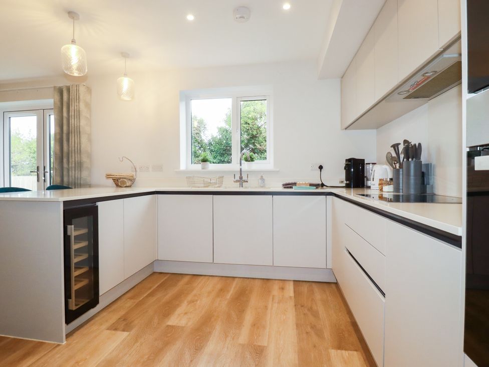 A kitchen with a countertop and sink at Chi Gwynn in Crantock