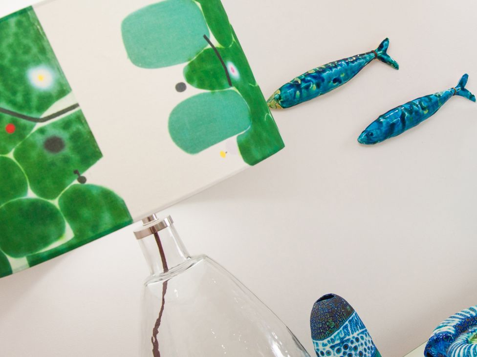 A lamp and ceramic fish decor at Ultramarine in Carbis Bay