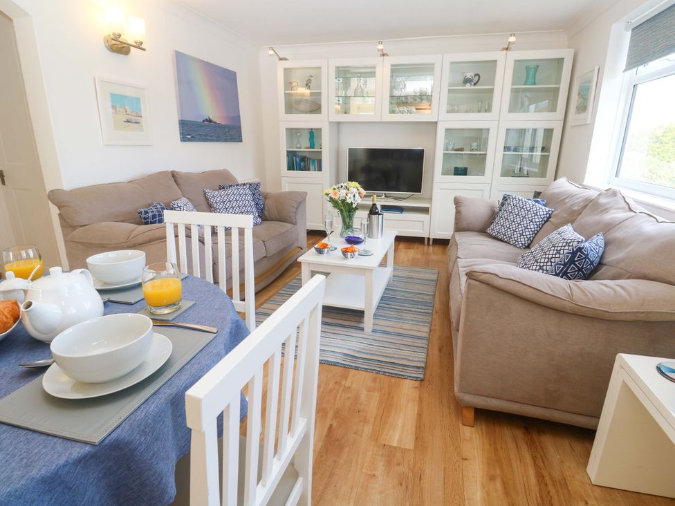 A living room with a sofa and coffee table at Atlantic Waves in Carbis Bay