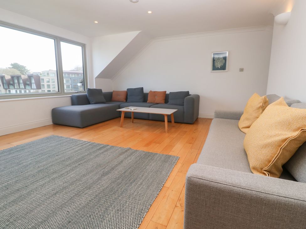 A living room with a sofa and coffee table at Bayside in Carbis Bay