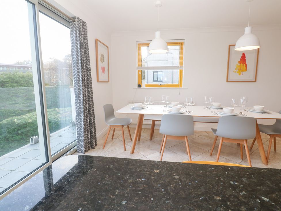 A dining room with a table set for dinner at Bayside in Carbis Bay