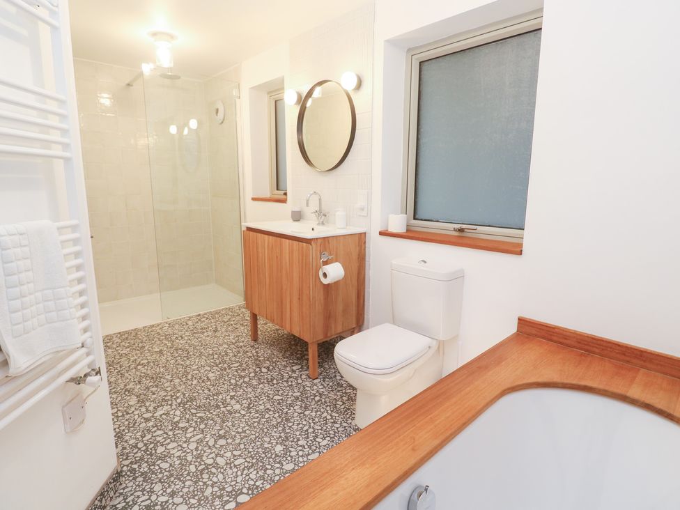 A bathroom with a sink, toilet, and shower at Bayside in Carbis Bay