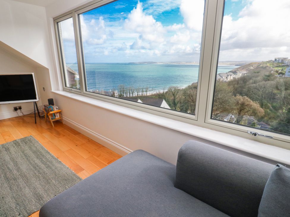 A living room with a view of the ocean at Bayside in Carbis Bay