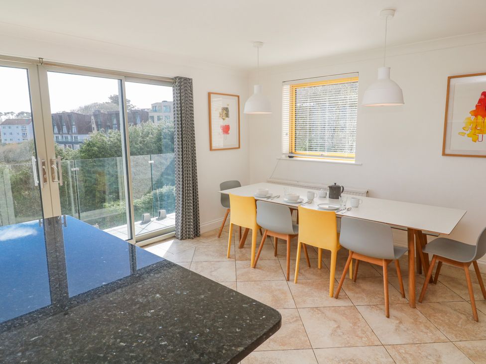A dining room with a table and chairs at Bayside in Carbis Bay