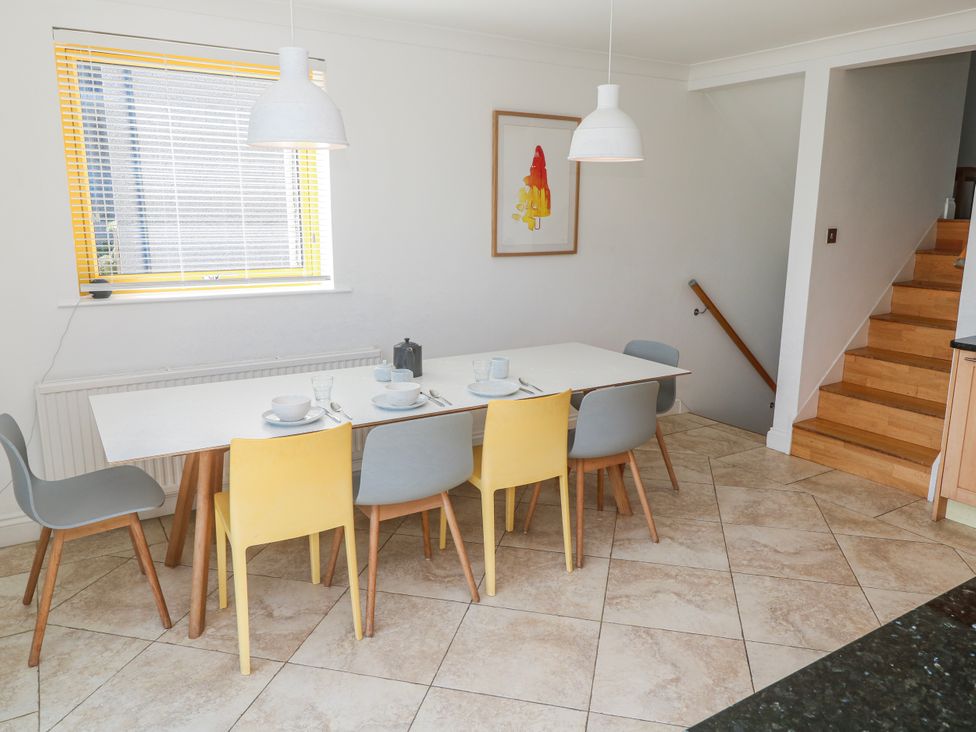 A dining room with a table and chairs at Bayside in Carbis Bay