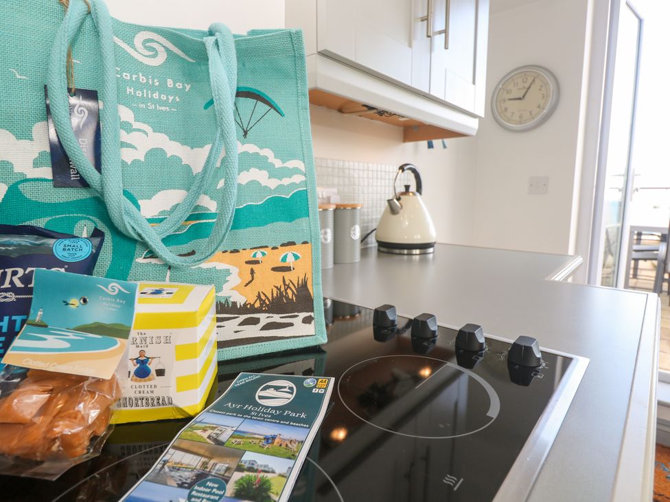 A kitchen with a bag and cooking utensils at Ocean Gem in Carbis Bay