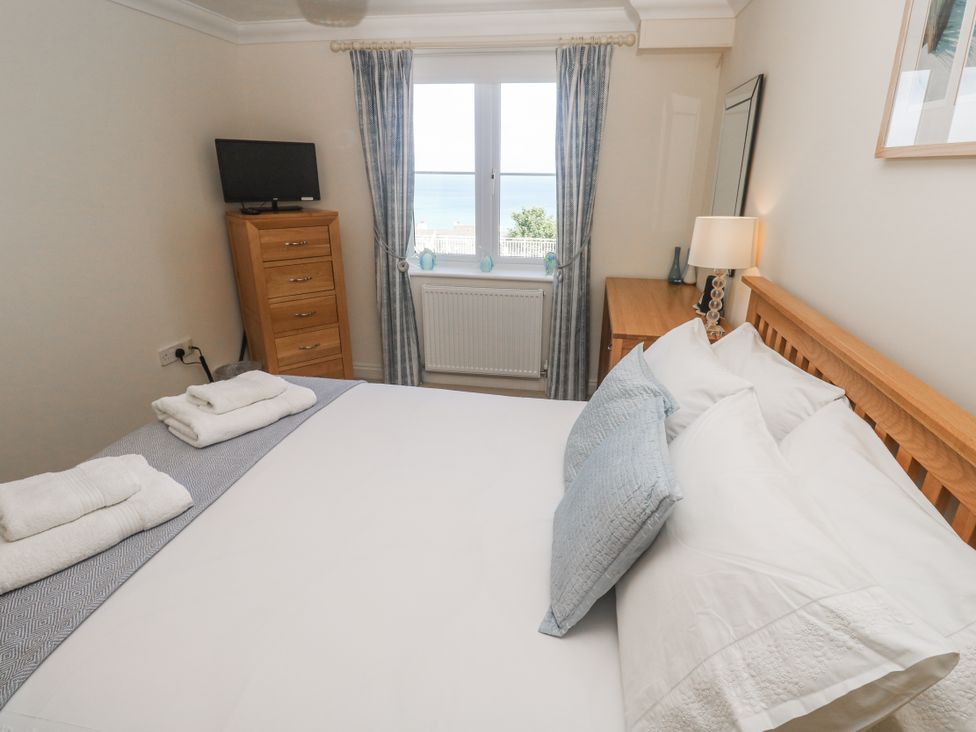 A bedroom with a bed and window at Golva in Carbis Bay