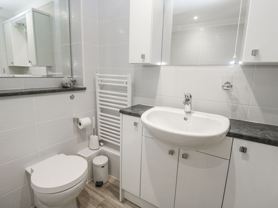 A bathroom with a sink and toilet at Golva, Carbis Bay