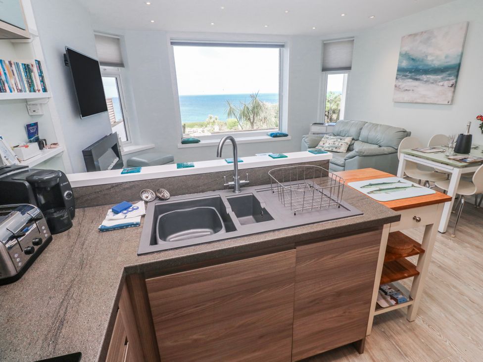 A kitchen with a sink and appliances at Island View in Carbis Bay