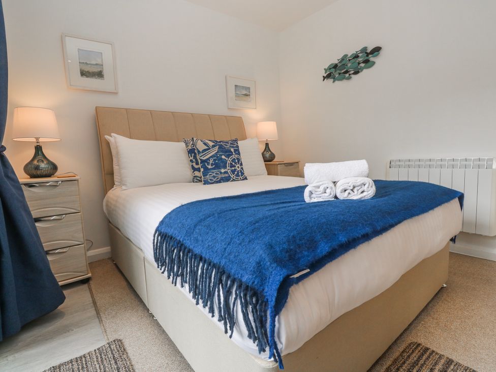 A bedroom with bed and bedside tables at Island View in Carbis Bay