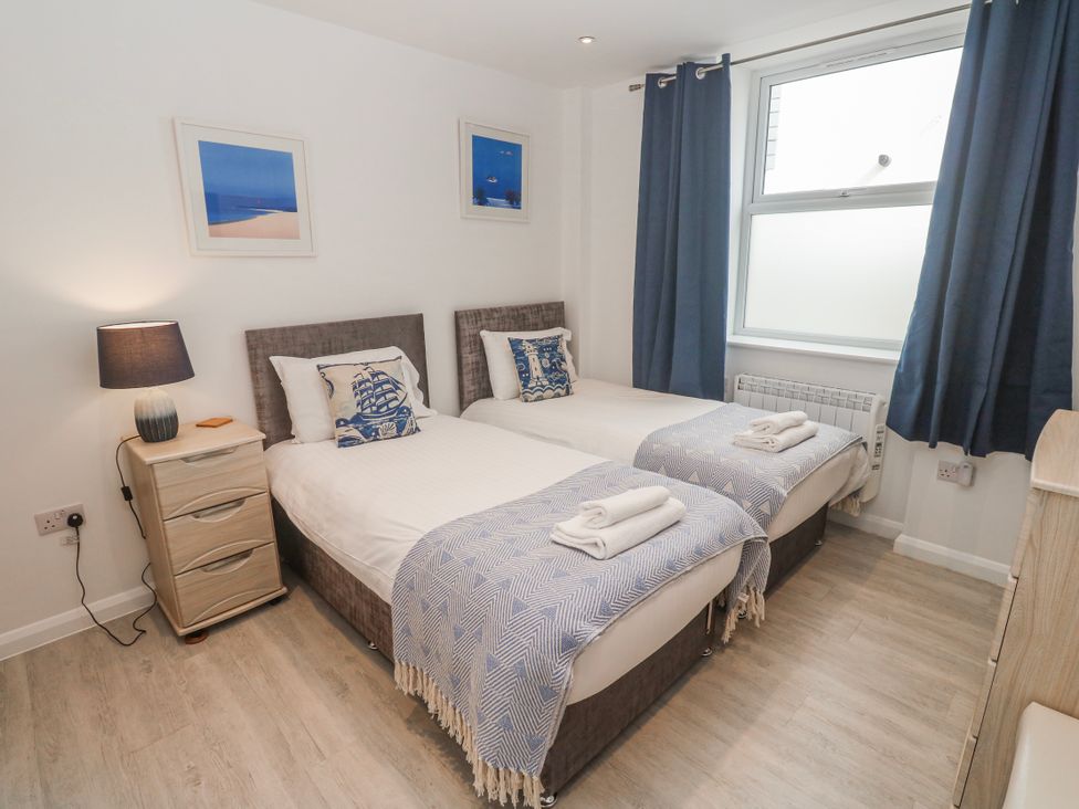 A bedroom with two beds in Island View at Carbis Bay