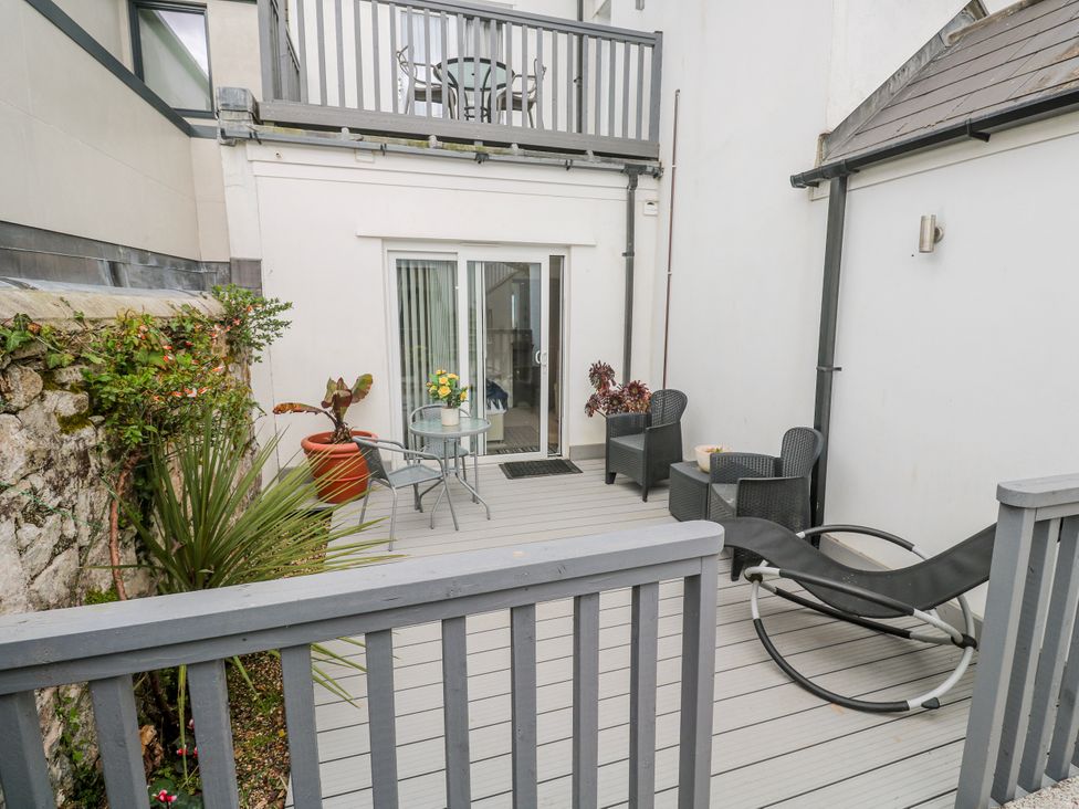 An outdoor area with a table and chairs at Island View in Carbis Bay