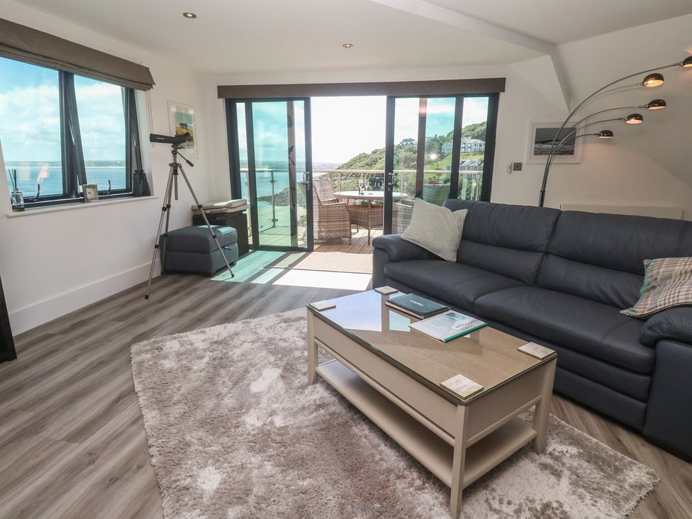 A living room with a sofa and coffee table at Oceania in St Ives