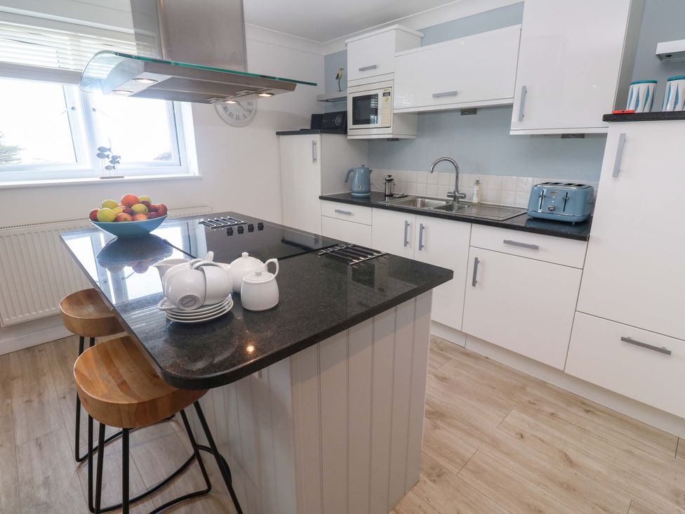 A kitchen with a kettle and a fruit bowl at Sea Breeze, Carbis Bay