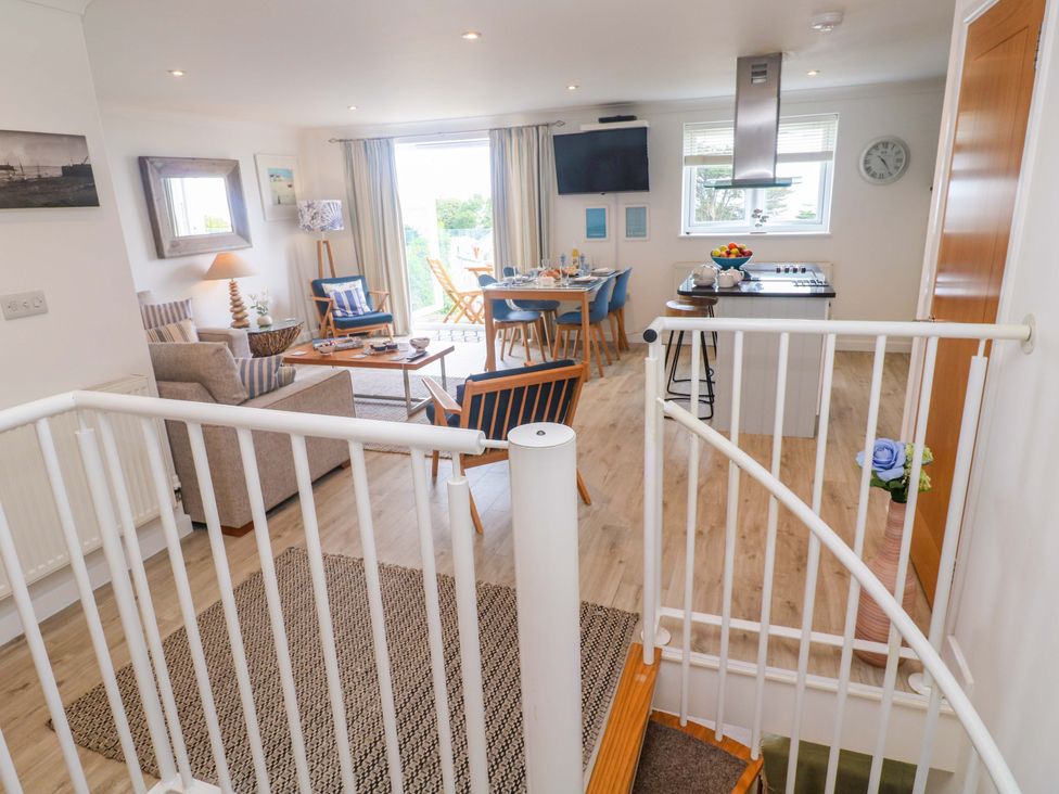 A living room and kitchen area at Sea Breeze in Carbis Bay