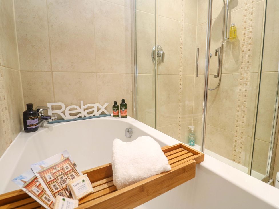 A bathroom with a bathtub and shower at Sea Breeze in Carbis Bay