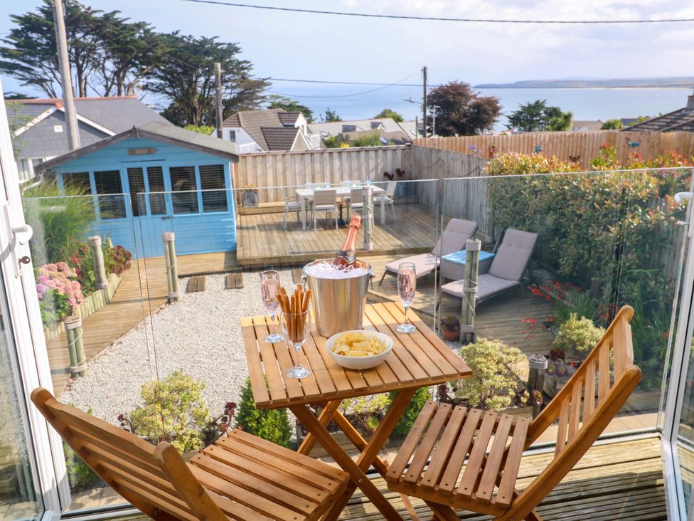 An outdoor area with a table and chairs at Sea Breeze, Carbis Bay