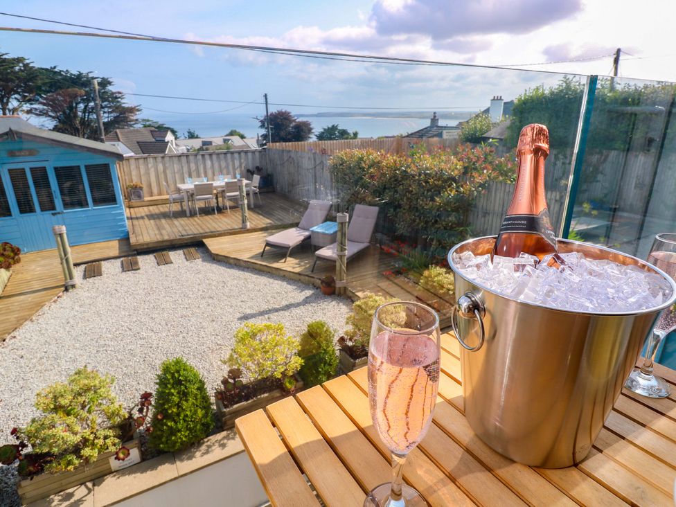 An outdoor area with a champagne bottle in an ice bucket at Sea Breeze in Carbis Bay