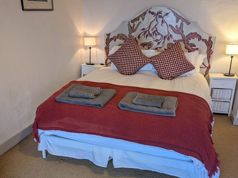 A bedroom with a bed and nightstand at The Ferry House Ramelton, County Donegal
