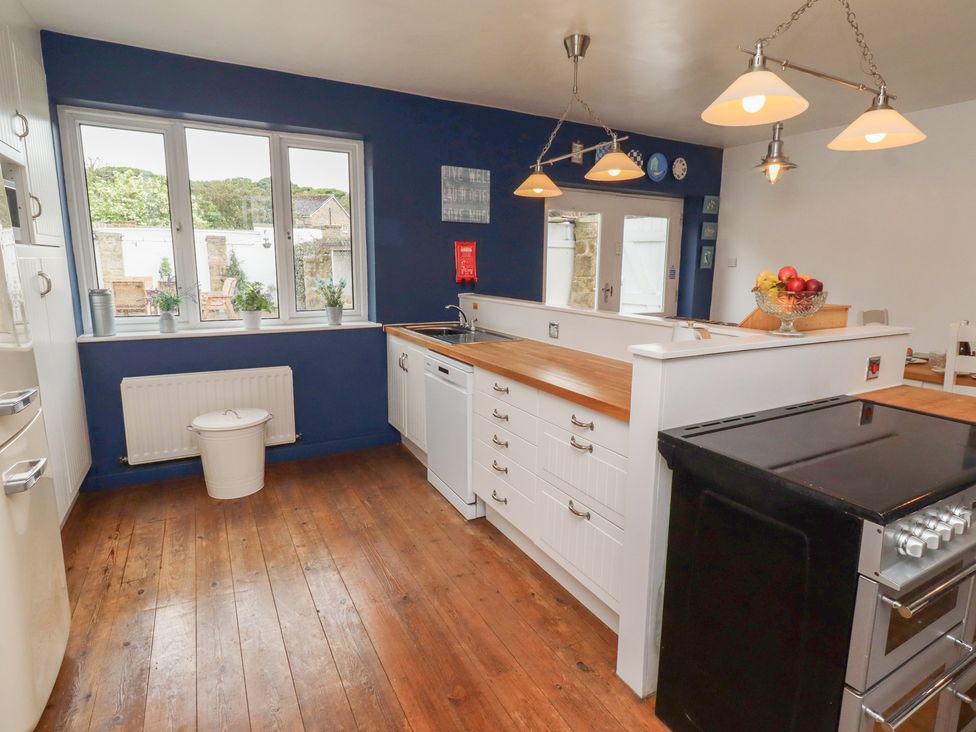 A kitchen with a window, sink, and countertop at ASTA COTTAGE, Cresswell