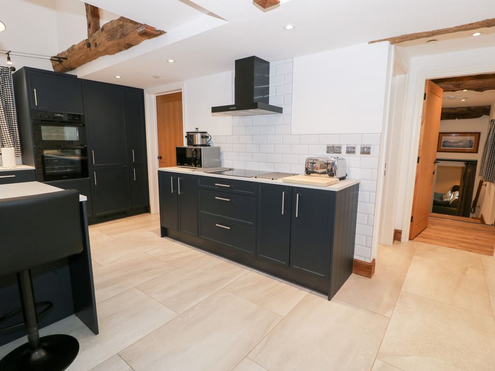 A kitchen with appliances and countertops at Merddwr in Cerrigydrudion