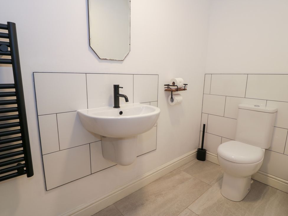 A bathroom with a sink and toilet at Merddwr in Cerrigydrudion