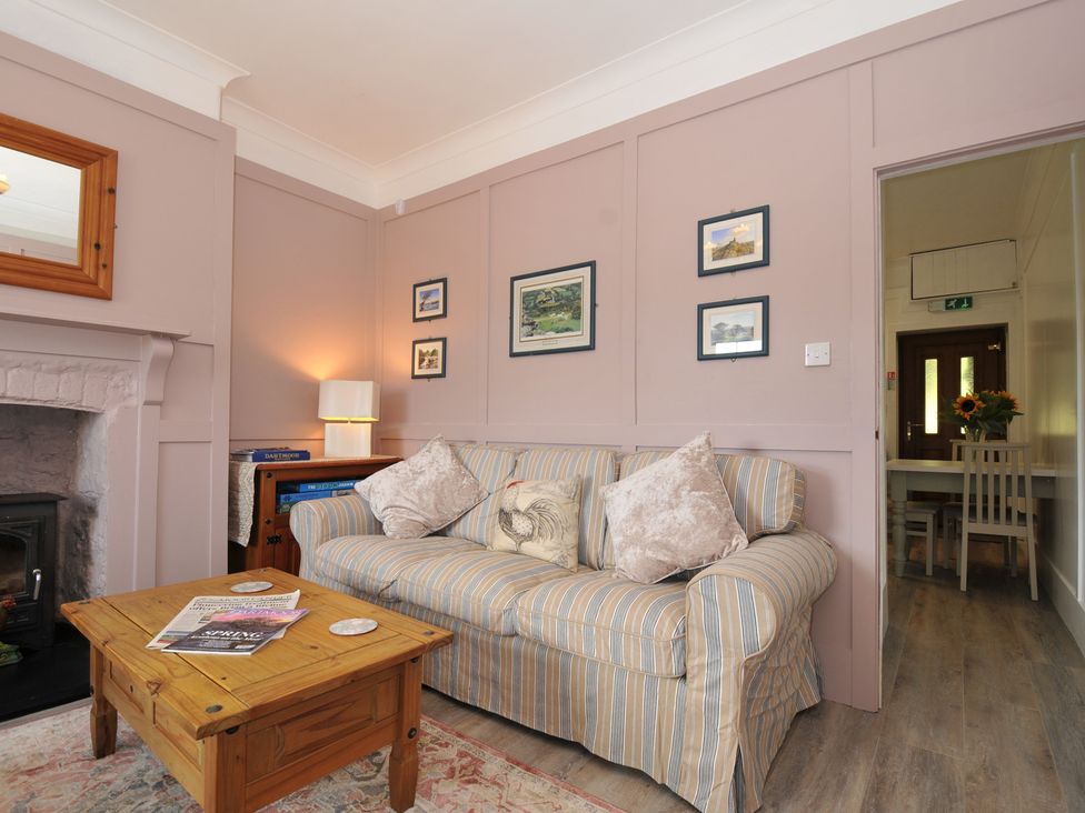 A living room with a sofa and coffee table at Tor View @ Fourwinds, Meldon near Okehampton