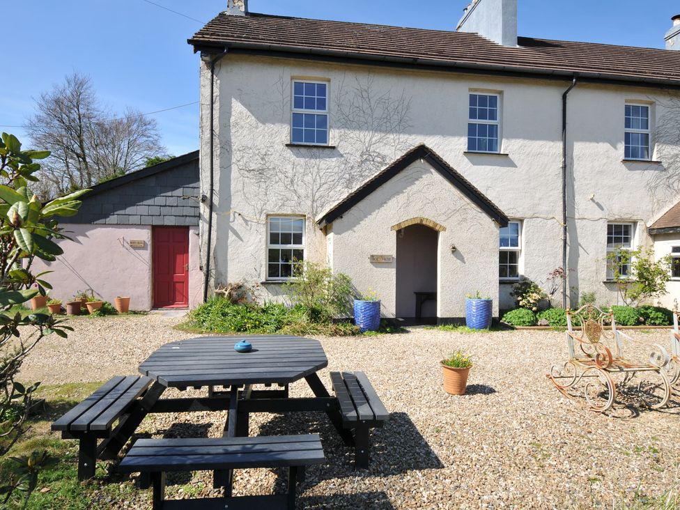 An outdoor area with a table and chairs at Tor View @ Fourwinds in Meldon near Okehampton