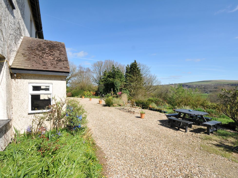 An outdoor area with a picnic table and gravel path at Tor View @ Fourwinds in Meldon near Okehampton