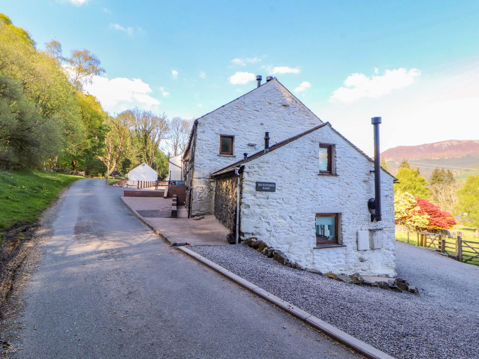 An outdoor view of a building beside a road at Swallow's Nest Thornthwaite near Braithwaite